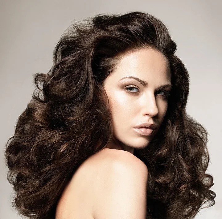 Dry and Damaged Hair Care: How to Repair and Restore Hair 2 Beautiful woman with shiny healthy hair after following dry and damaged hair care routine