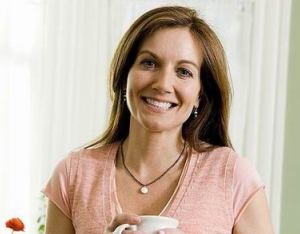 Slim happy woman showing successful healthy weight loss after 40 transformation