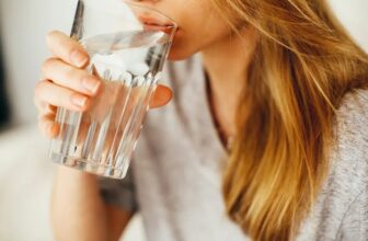 Woman drinking water to support healthy weight loss and hydration