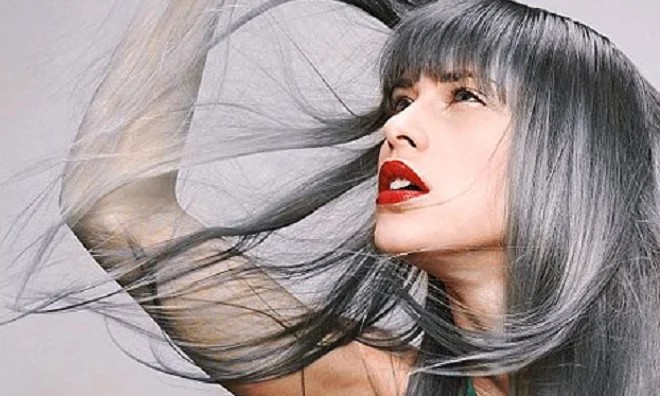 Woman with grey hair showing premature greying before natural treatment