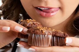 Woman enjoying a low calorie apple muffin as a healthy snack option