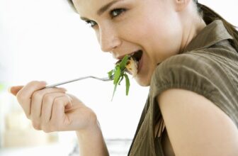 woman eating chicken breast low in calories healthy protein meal